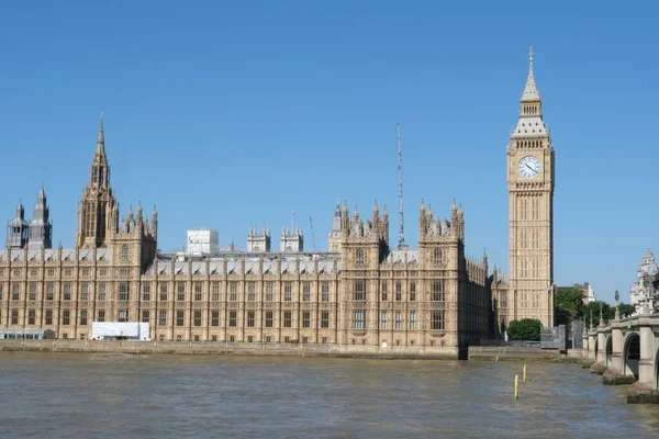 View of London, Houses of Parliament building with Big Ben. British history, Palace of Westminster, river bank. 