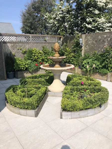Formal courtyard garden with fountain