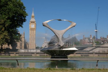 London, UK - July 11, 2022: Big Ben and the fountains Revolving Torsion, in Gabo Fountain Garden at St Thomas' Hospital in London clipart