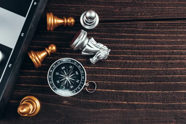 compass and chess piece on chess board game for ideas, challenge,  leadership, strategy, business, success or abstract - Stock Image -  Everypixel