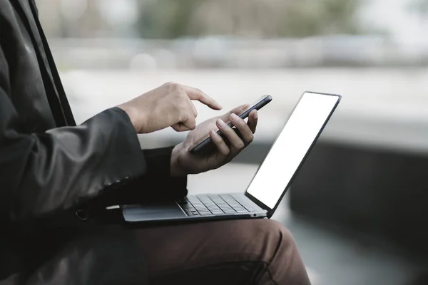 Stock image Employees fired or resigned from the company are using their mobile phones to find a jobs and schedule an interview