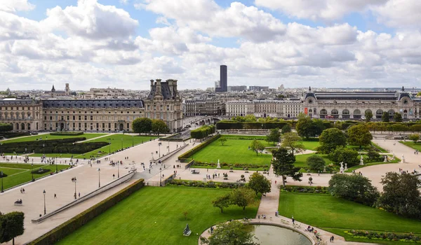 stock image Beautiful panoramic view of the Tuileries gardens and the cityscape on a cloudy summer day. Paris, France.