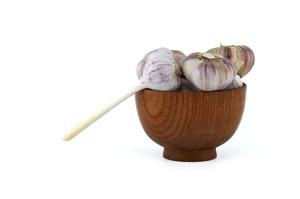 stock image Freshly harvested garlic bulbs in wooden bowl isolated on white background