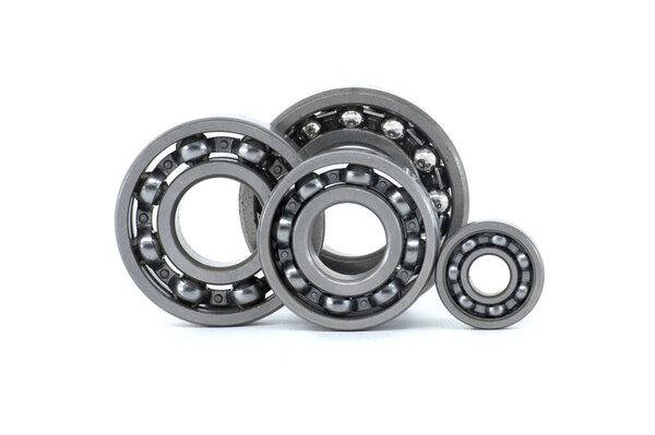 Set of various ball bearings isolated on white background. Car bearings, auto parts, automobile components for the engine and chassis suspension