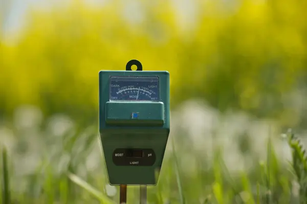 stock image Soil moisture, light intensity and PH testing meter in close up, agriculture technology concept