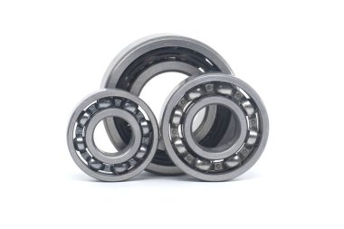 Ball bearings without seal and deep groove ball bearing with steel seal isolated on white background clipart