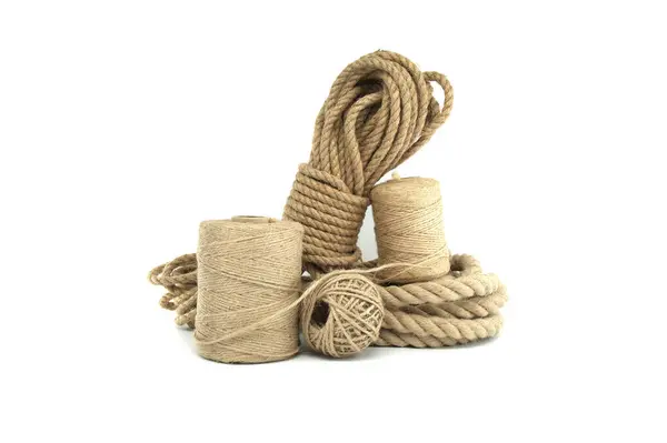 stock image Spools of natural fiber rope presented with varying thicknesses isolated on white background