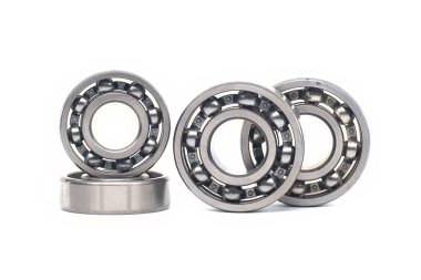 Array of deep groove ball bearing without seal isolated on white background. Car bearings, auto parts, automobile components for the engine and chassis suspension clipart