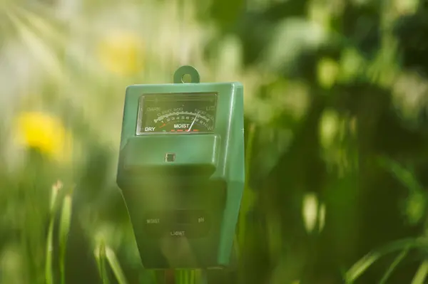 stock image Agricultural meter in close up over blurred background. High technology agriculture concept