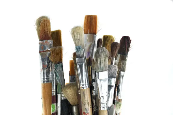 stock image Assortment of various types and sizes of paintbrushes against a white background