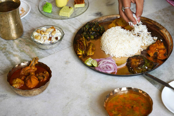 EATING BENGALI THALI IN COPPER PLATE WITH CHICKEN SALAD SWEET SIDE DISHES