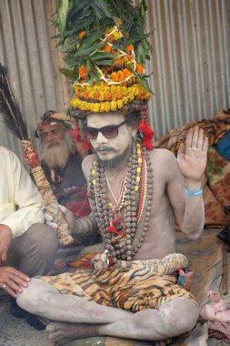 15th January 2023, Kolkata, West Bengal, India. Portrait of Young sadhu at Kolkata Gangasagar Transit camp