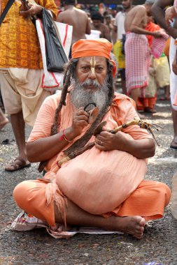 14th October 2023, Babughat, Kolkata, West Bengal, India. Hindu Sadhu with Manjira at Religious Gathering