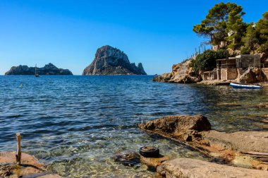 Panoramic views of the island of Es Vedra and Vedranell, located on the coast of the island of Ibiza. In front of the Cala d'Hort beach, one of the most visited by tourists.