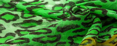 İpek kumaş yeşil, leopar desenli. Hafif leopar desenli ipek senin tasarımın için mükemmel, şık görünüyor ve kaba değil! Doku, arkaplan, desen