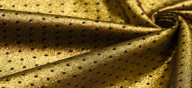 Brocade altın rengidir. Küçük bir polka şeklinde. Brocade genellikle altın ve gümüş ipliklerle renklendirilmiş ipekten yapılan süslü bir mekik kumaşıdır. Rönesans 'ta önemli bir kumaş.