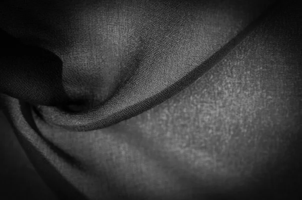 深色的黑色雪纺丝是一种柔软的透明织物 由于使用捻纱 有轻微的粗糙度 背景纹理 — 图库照片