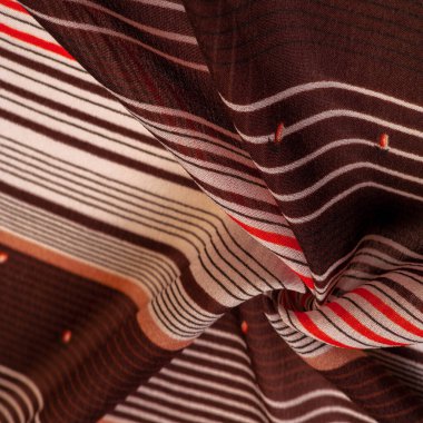 Kahverengi ve beyaz çizgili ipek kumaş. Meksika güdüleri olan bir panço. doku, arkaplan