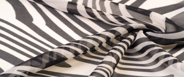 İpek kumaş, siyah beyaz soyut çizgiler. Soyut siyah beyaz desenli büyülü bir şekil. Retro modern dekor, tekstil sanatı, tasarım, doku, arkaplan, kalıp