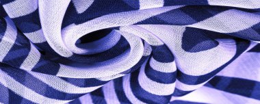 İpek kumaş, mavi ve beyaz soyut çizgiler. Soyut mavi ve beyaz desenlerin sihirli şekli. Retro modern dekor, tekstil sanatı, tasarım, doku, arkaplan, kalıp