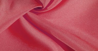 İpek kumaş yakut kırmızısıdır. Renkli ipek kumaşın dokusu arka plan olarak kullanılabilir