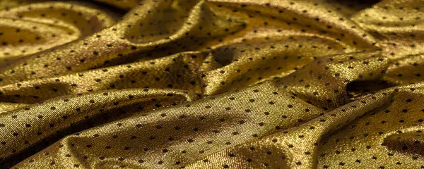 Brocade altın rengidir. Küçük bir polka şeklinde. Brocade genellikle altın ve gümüş ipliklerle renklendirilmiş ipekten yapılan süslü bir mekik kumaşıdır. Rönesans 'ta önemli bir kumaş.