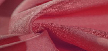 İpek kumaş yakut kırmızısıdır. Renkli ipek kumaşın dokusu arka plan olarak kullanılabilir
