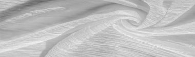 İpek kumaş. Beyaz buruşuk kumaşın dokusu. Beyaz buruşuk, dalgalı yüzey dokusu. 