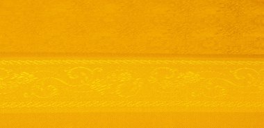 Sarı kumaş. Kehribar turuncu. Soyut doku. Kumaş liflerinden yapılmış renkli yüzey. Doku, arkaplan, desen