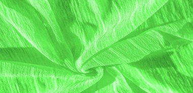 İpek kumaş. Yeşil kırışık kumaş dokusu. Yeşil buruşuk, dalgalı yüzey dokusu. Yakın çekim, yumuşak odaklanma. arkaplan, kalıp