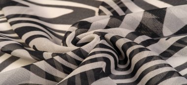 İpek kumaş, siyah beyaz soyut çizgiler. Soyut siyah beyaz desenli büyülü bir şekil. Retro modern dekor, tekstil sanatı, tasarım, doku, arkaplan, kalıp