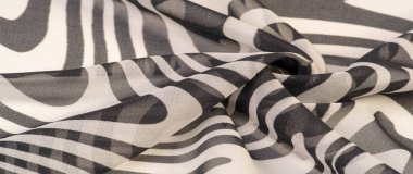 İpek kumaş, siyah beyaz soyut çizgiler. Soyut siyah beyaz desenli büyülü bir şekil. Retro modern dekor, tekstil sanatı, tasarım, doku, arkaplan, kalıp