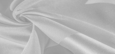İpek beyazdır. Beyaz gri saten doku, gümüş kumaş, ipek panorama, arka plan, güzel yumuşak bulanık desenli. Doku, arkaplan deseni