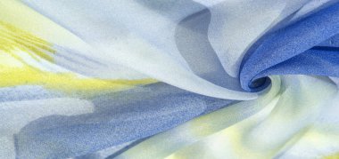 Yumuşak mavi, soyut desenleri ve yatak tonları olan ipek kumaş, sarı ve beyaz tonlarda. Doku, desen, koleksiyon