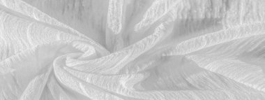 İpek kumaş. Beyaz buruşuk kumaşın dokusu. Beyaz buruşuk, dalgalı yüzey dokusu. Yakın çekim, yumuşak odaklanma. arkaplan, kalıp