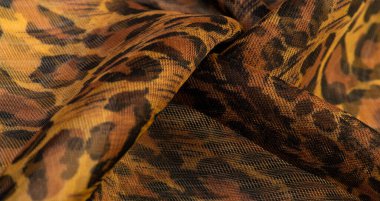 İpek kumaş, leopar derisi, kahverengi-sarı siyah tonlar, projeleriniz için sıcak Afrika safarisi, doku arka planı, desen