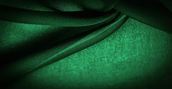 光沢のある濃い緑色のシフォンシルク エメラルド抽象的な背景 緑の布が閉じます ツイスト糸の使用により若干の粗さ マット クレープ を持つ柔らかい透明生地です — ストック写真