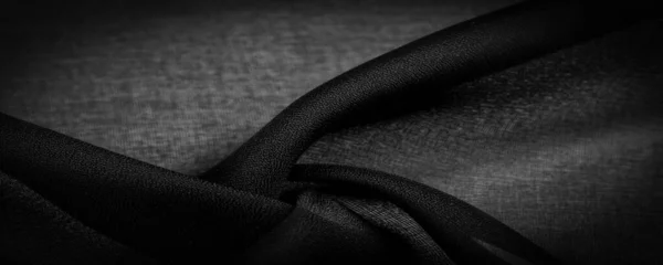 ダークブラックのシフォンシルクは ツイスト糸の使用により若干のラフネス マット クリップ を持つ柔らかい透明生地です 背景色 — ストック写真