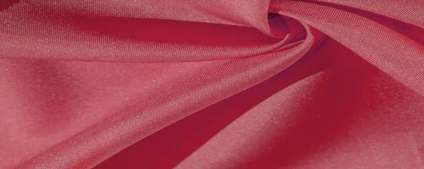 stock image The silk fabric is ruby red. texture of colored silk fabric - can be used as a background