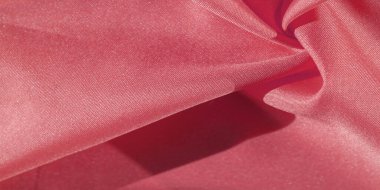 İpek kumaş yakut kırmızısıdır. Renkli ipek kumaşın dokusu arka plan olarak kullanılabilir