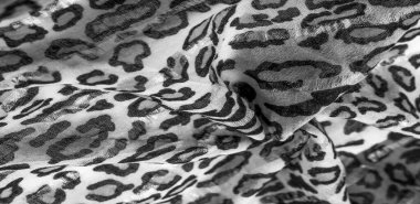 İpek kumaştan siyah beyaz leopar desenli. Leopar desenli hafif ipek senin tasarımına mükemmel uyacak, şık görünüyor ve kaba değil! Doku, arkaplan, desen