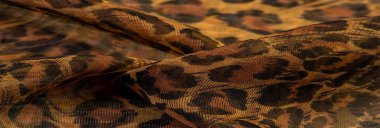 İpek kumaş, leopar derisi, kahverengi-sarı siyah tonlar, projeleriniz için sıcak Afrika safarisi, doku arka planı, desen