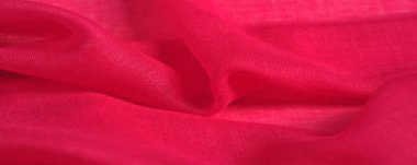 Kırmızılı ipek kumaş. Soyut arka plan lüks kumaş veya sıvı dalga veya dalgalı kıvrımlar