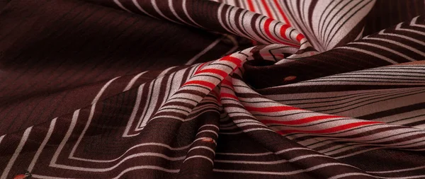 stock image silk fabric, brown background with striped pattern of white and red lines, spanish theme, texture, pattern, collection