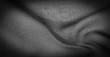 Koyu siyah şifon ipeği, bükülmüş iplik kullanımı nedeniyle hafif pürüzlü (matte, creped) yumuşak şeffaf bir kumaştır. Arkaplan dokusu