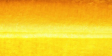 Parlak sarı madde. Bu ipek son derece pürüzsüz ve yumuşak, güzel pürüzsüz bir dokusu var. arkaplan deseni