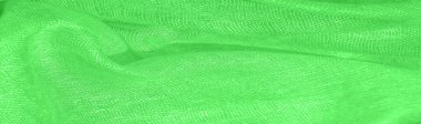 Parlak yeşil malzeme. Bu ipek son derece pürüzsüz ve yumuşak, güzel pürüzsüz bir dokusu var. arkaplan deseni