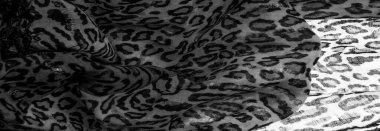 İpek kumaştan siyah beyaz leopar desenli. Leopar desenli hafif ipek senin tasarımına mükemmel uyacak, şık görünüyor ve kaba değil! Doku, arkaplan, desen