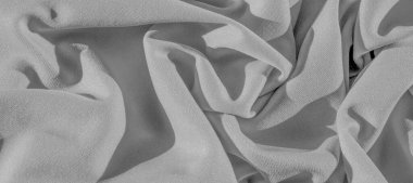 Yeşil ipek. Pürüzsüz, zarif yeşil ipek kumaş, fotokopi alanı ile soyut bir arkaplan olarak kullanılabilir. Renkli doku