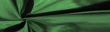 Zümrüt yeşili ipek kumaş, metalik kumaş gölgeleri, dekoratif tasarım için parlak yeşil metalik zemin, dekor unsuru, duvar kağıdı. desen deseni